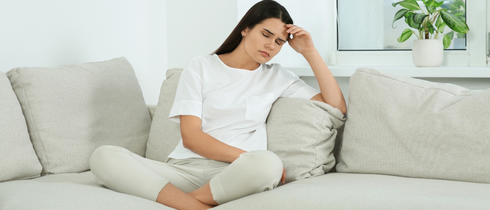 Hearing Loss in Women Over 40: Hormonal Changes, Early Signs & Solutions | Aanvii Hearing Middle-aged woman touching her ear, showing concern—highlighting hearing loss linked to hormonal changes in women over 40.